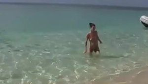 Beautiful amateur undressing at the beach