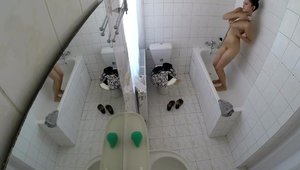 Asian girl voyeur bends over in toilet